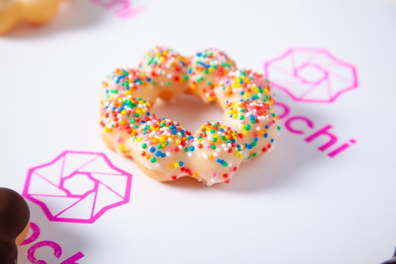 a glazed ring-shaped mochi donut topped with rainbow sprinkles (no classic daifuku, dorayaki or taiyaki candidate found; this is the closest mochi-based product on offer) â Demochi Melbourne CBD, Melbourne CBD