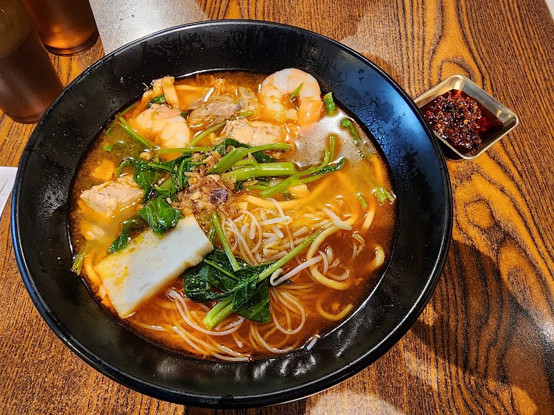 bowl of Hokkien prawn noodle soup (soupy Singapore/Malaysian style) with prawns, tofu puff and greens in a rich orange prawn broth â Rickshaw Food, Burwood