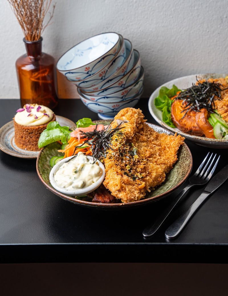 close-up plated panko-crumbed cutlet with shredded cabbage, carrot and tartare sauce (restaurant sells pork, chicken and fish katsu, exact protein not certain) â Sandoitchi Chatswood, Chatswood