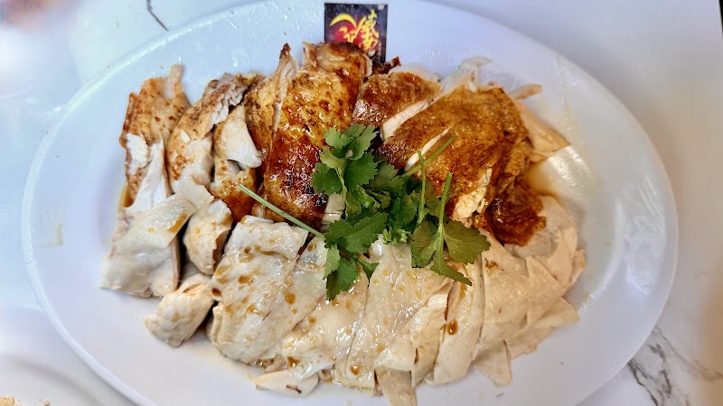 a platter of poached and roast Hainanese chicken with coriander â Wee Nam Kee, Melbourne CBD